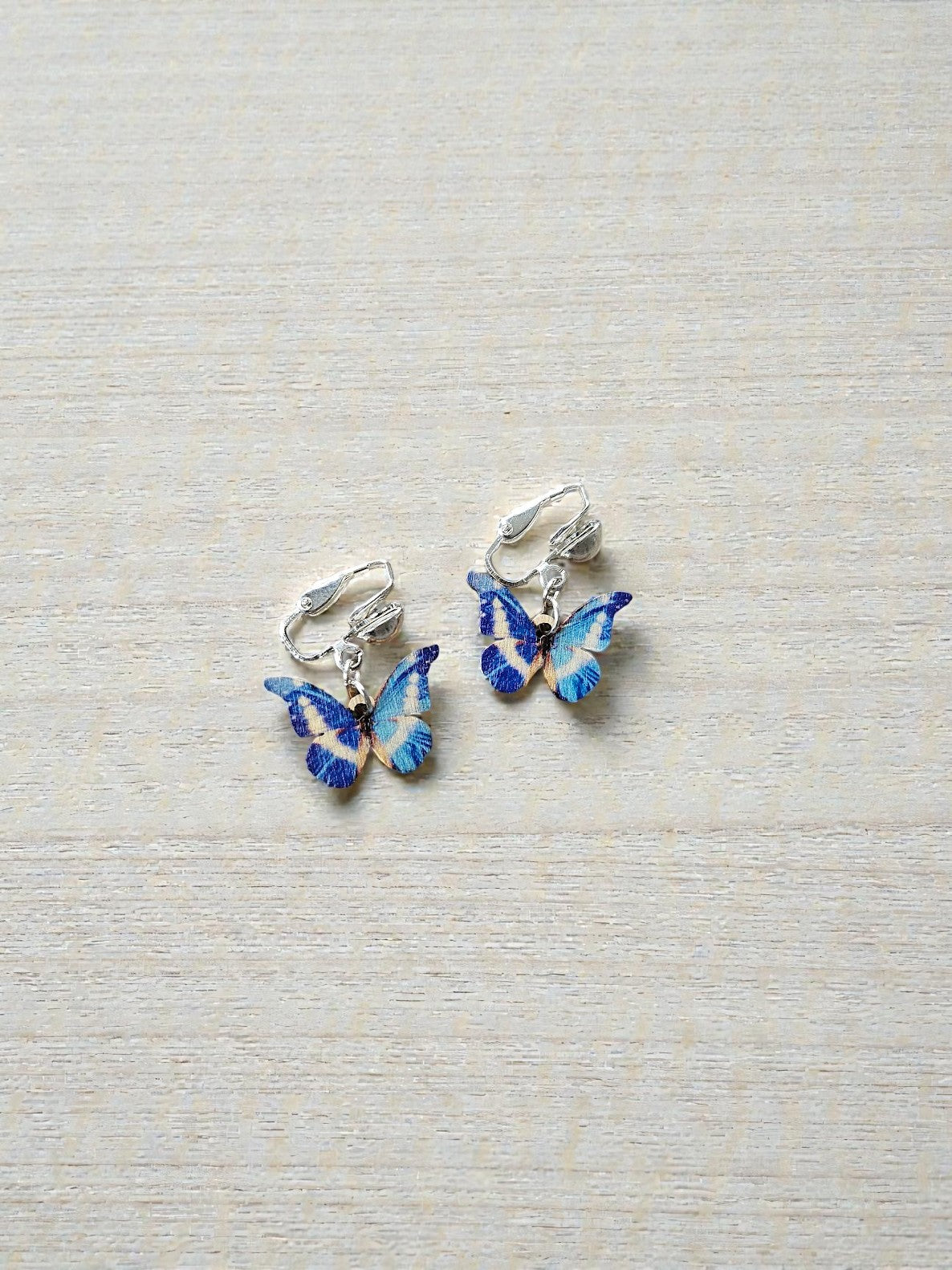 Blue Wooden Butterfly Clip on Dangle Earrings on Silver Clips