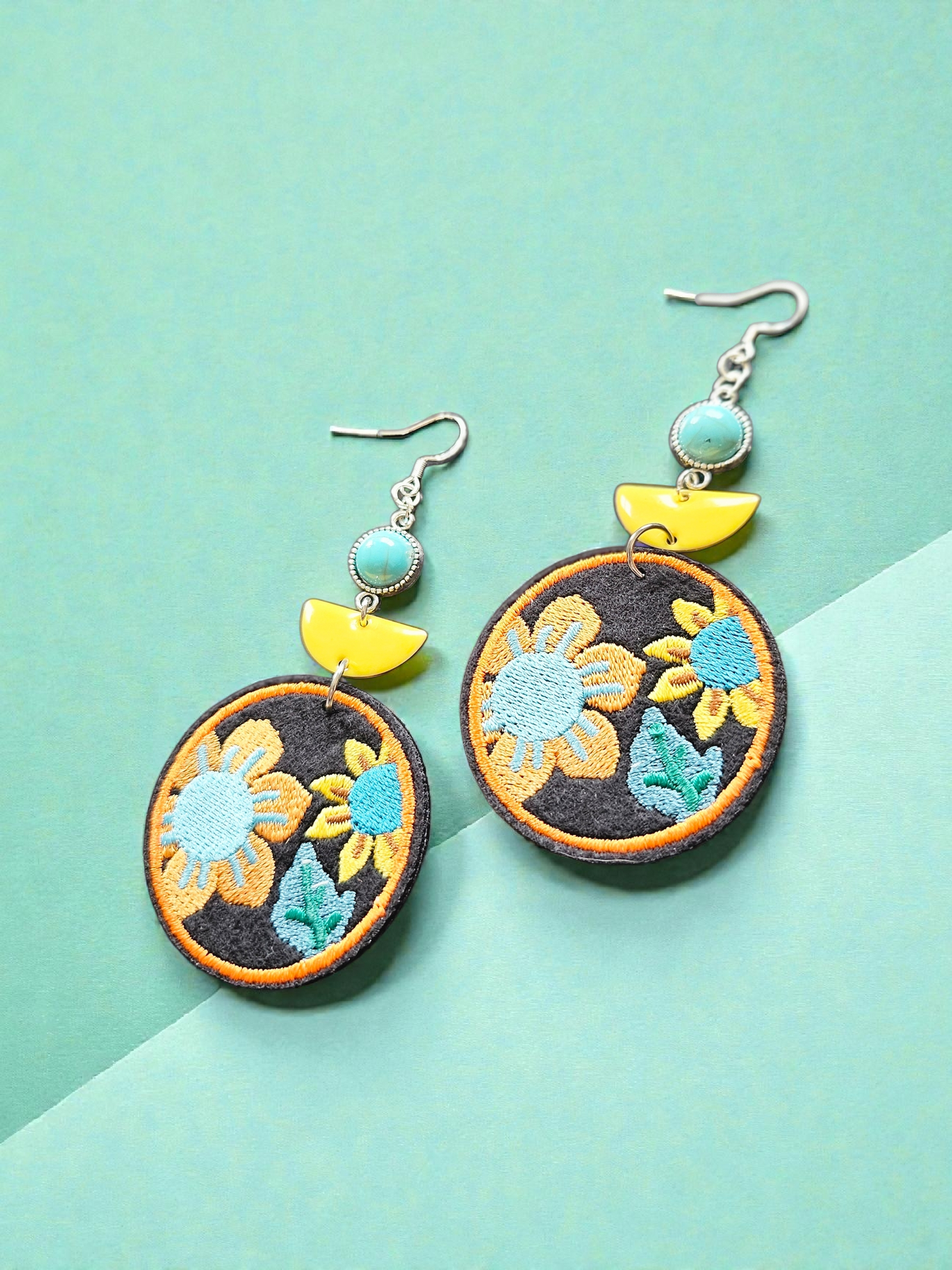 Embroidered Floral Circles with Yellow Ceramic and Teal Accents Dangle Earrings