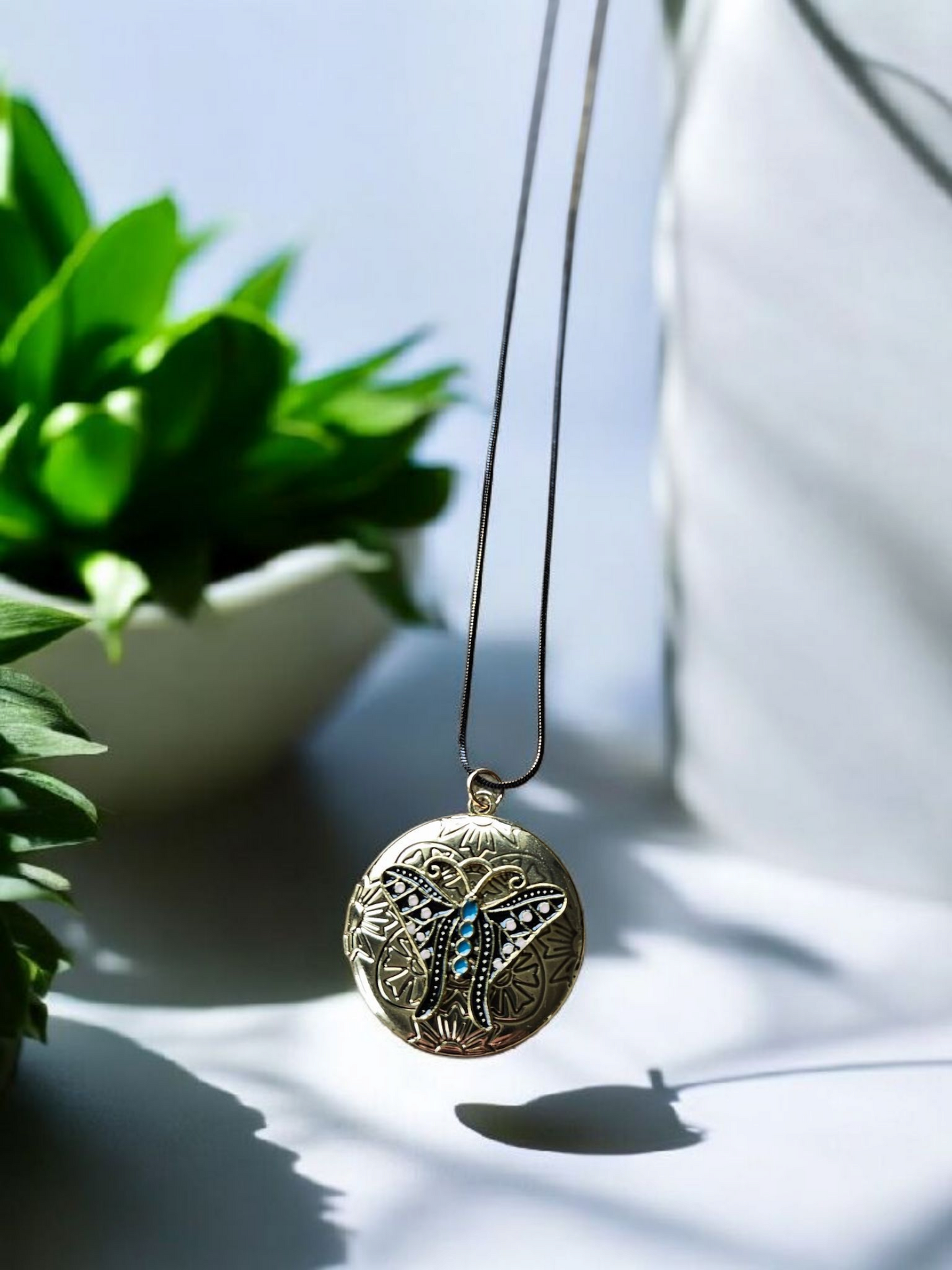 Gold and Teal Moth Locket on Long Black and Gold Shimmer Chain