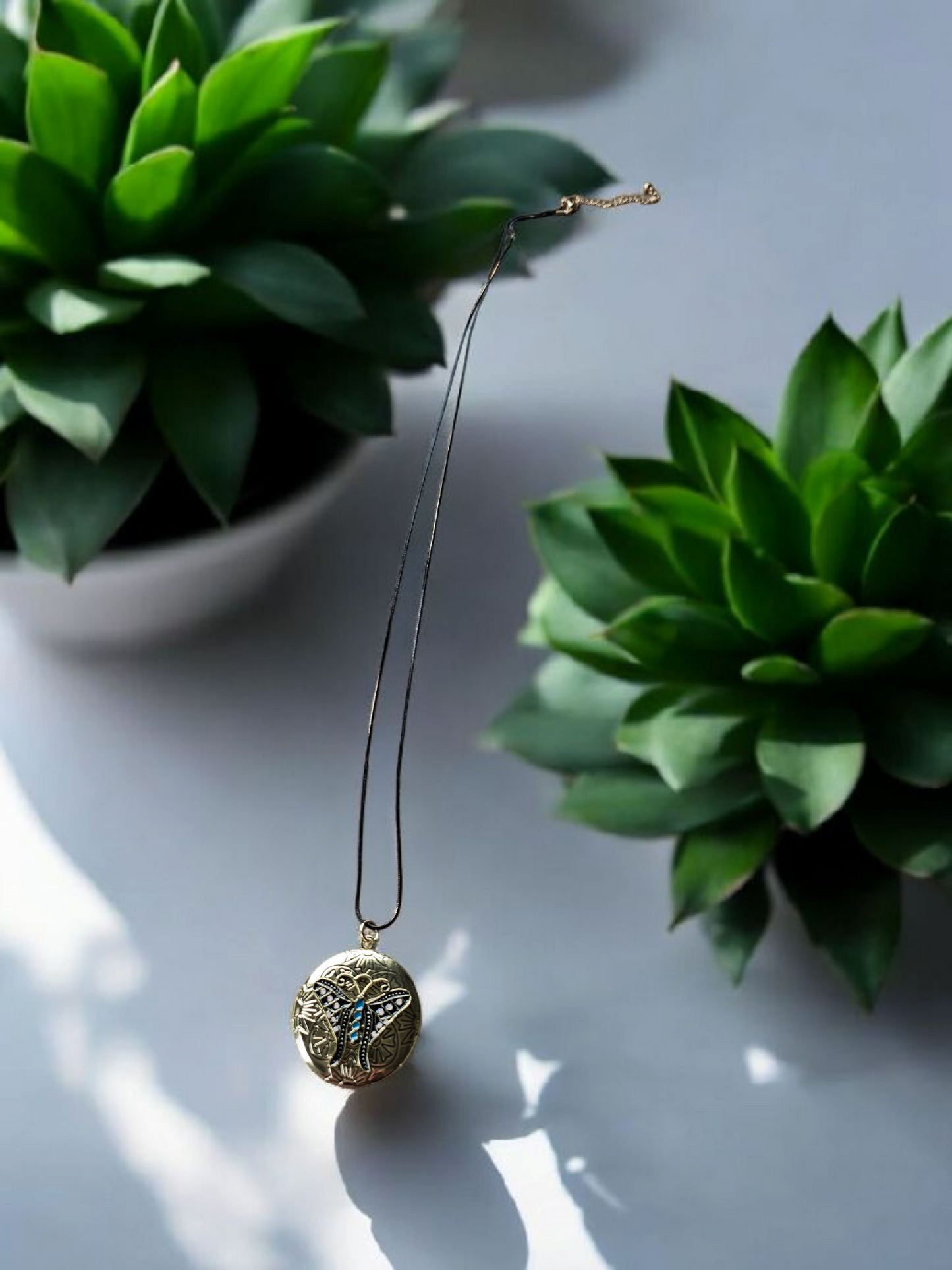 Gold and Teal Moth Locket on Long Black and Gold Shimmer Chain