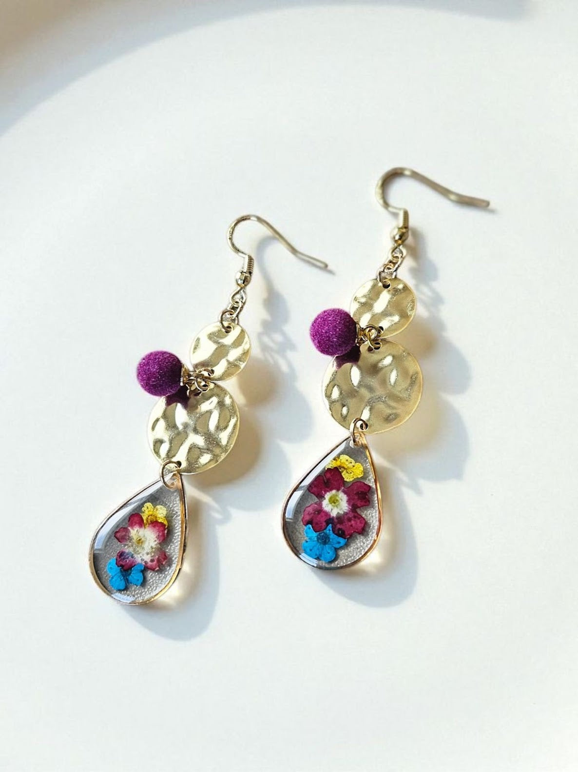 Beautiful Yellow, Purple, and Blue Pressed Flowers in Teardrop on Golden Hammered Circles with Purple Velvet Accent Charm Dangle Earrings