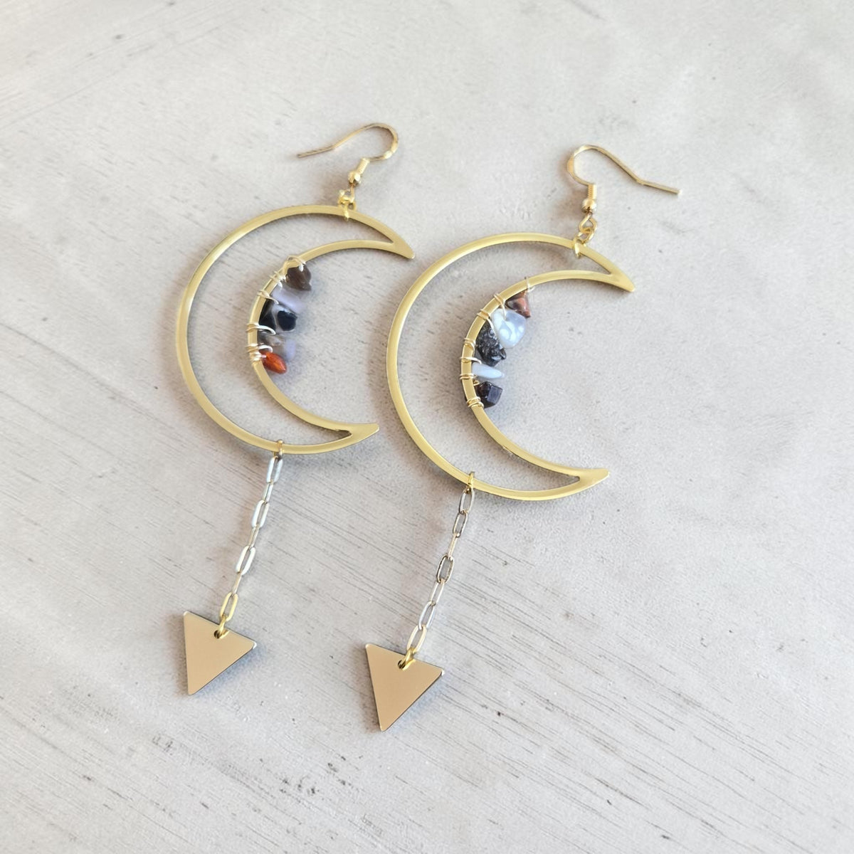 Fury Jewelry & Design gold-tone crescent moon dangle earrings with gemstone chips and geometric triangle charms.