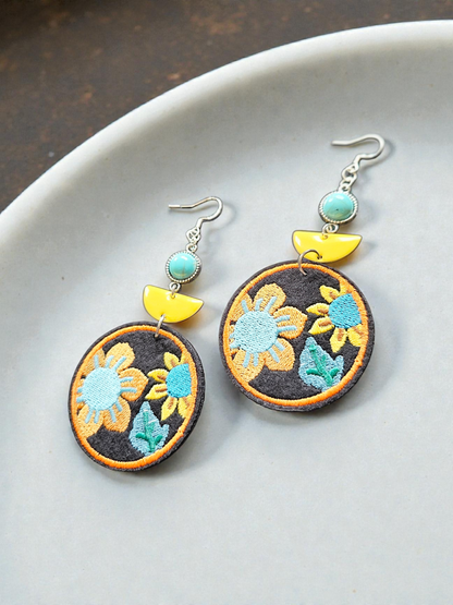Embroidered Floral Circles with Yellow Ceramic and Teal Accents Dangle Earrings