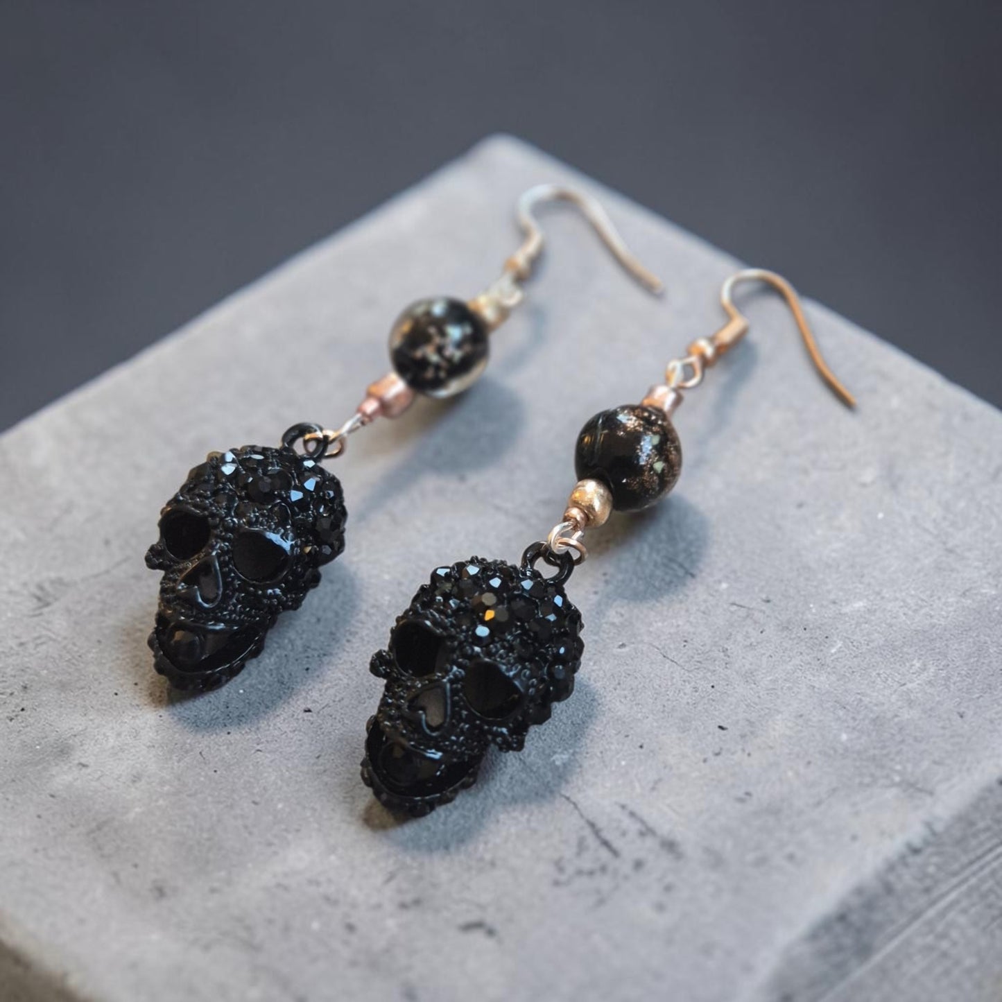 Blingy Black Skulls on Rose Gold Dangle Earrings