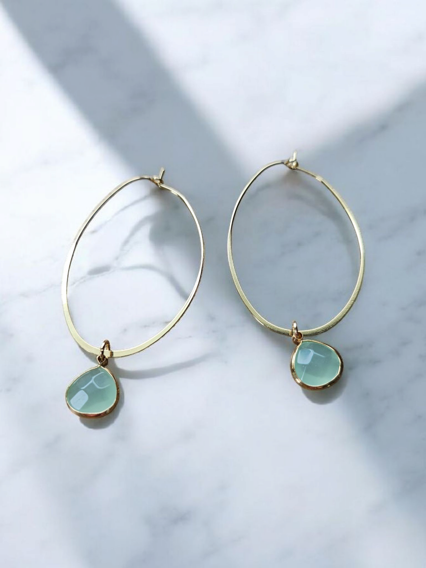 Round Teal Gemstone on Gold Oval Hoops