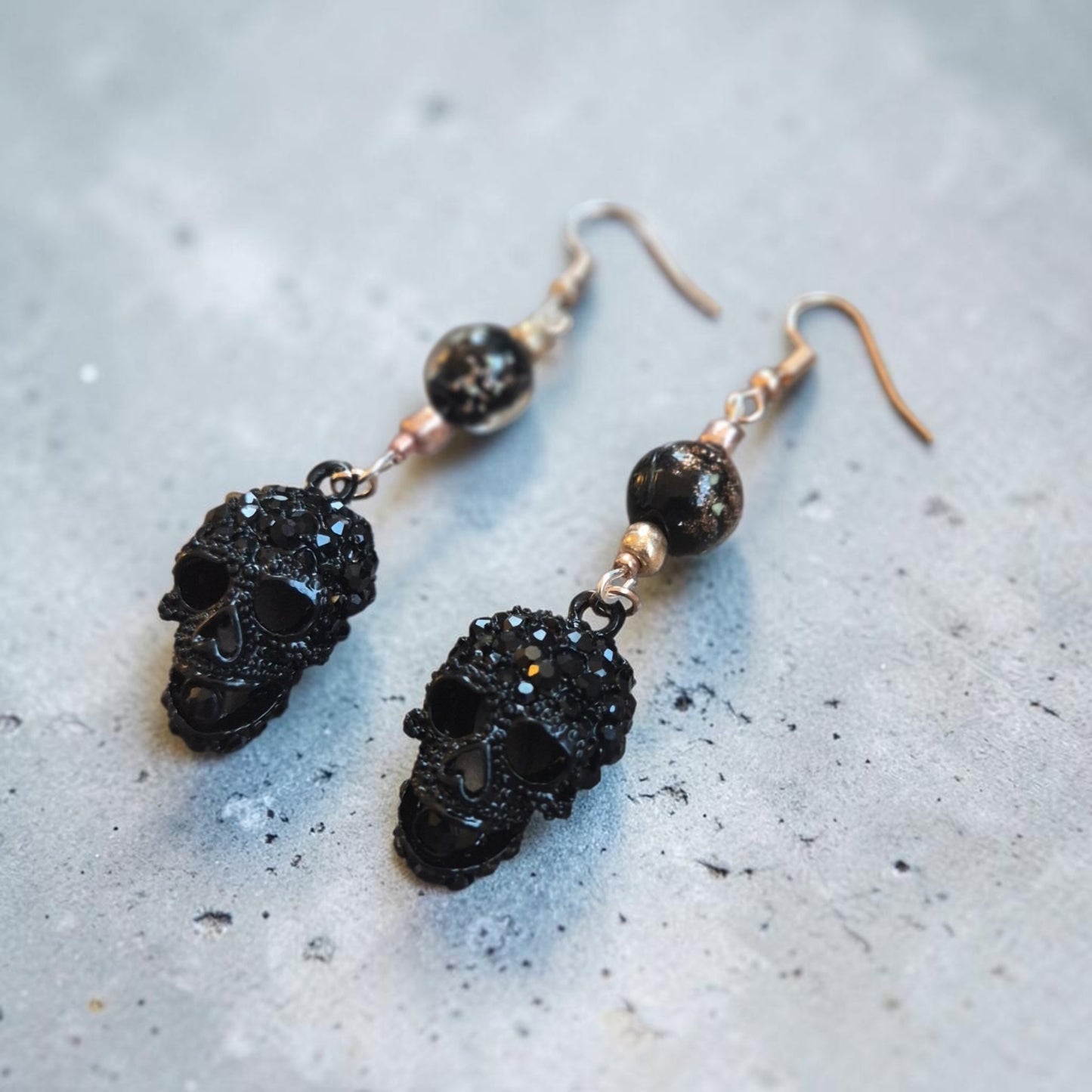 Blingy Black Skulls on Rose Gold Dangle Earrings