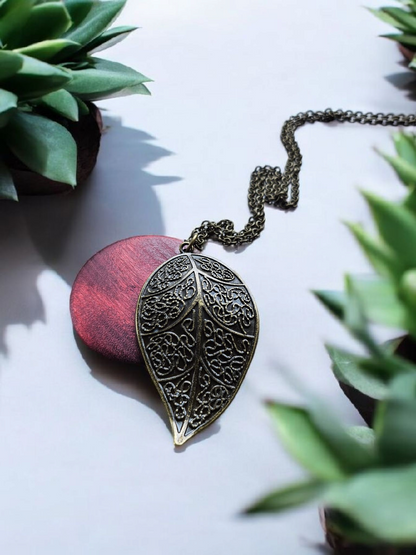 Bronze Leaf and Burgundy Wooden Circle on Long Bronze Necklace
